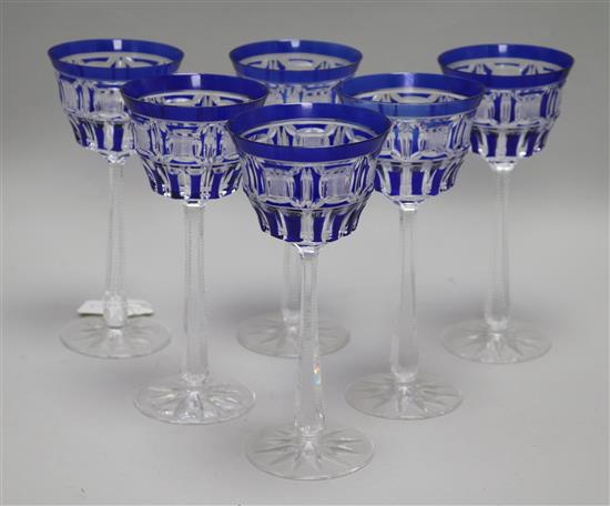 A set of six blue overlay glasses